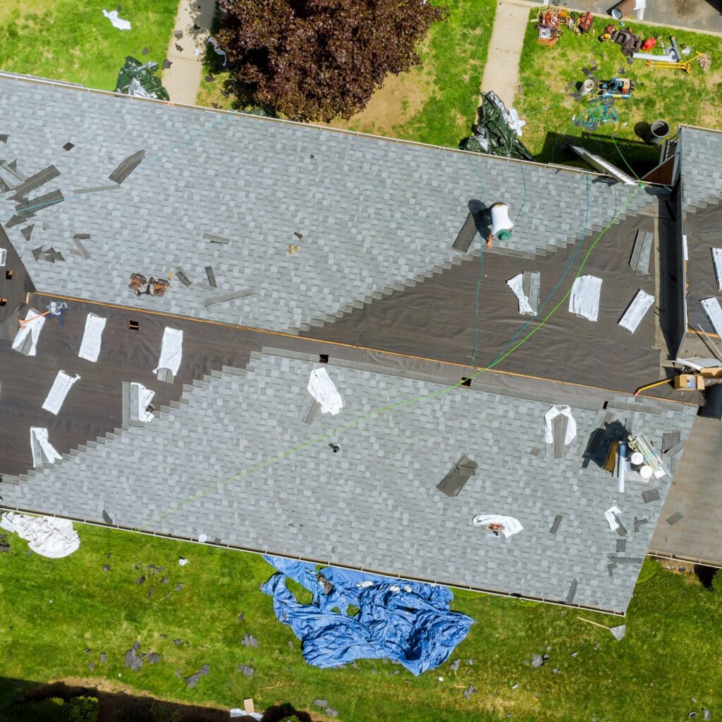 Roofer repair replace shingle that has been damaged and needing replacement